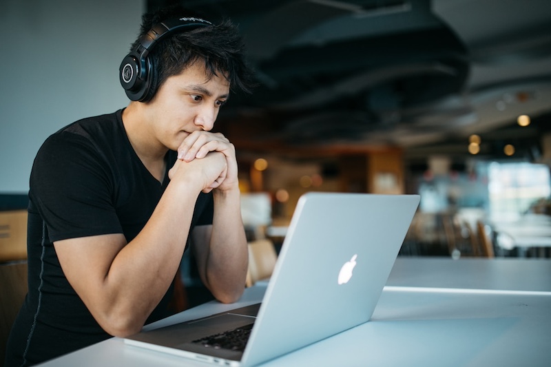 A male professional enhancing collaboration and communication using RFP automation tools.
